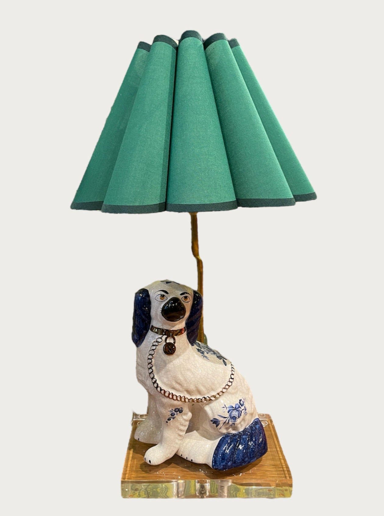 PAIR OF BLUE AND WHITE STAFFORDSHIRE STYLE PORCELAIN DOG LAMPS WITH GREEN RUFFLE SHADES