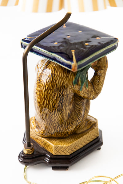 FRUIT THROWING MONKEY LAMP WITH STRIPED SHADE