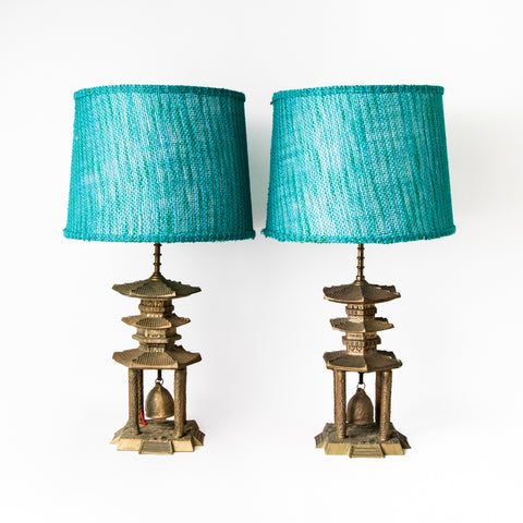 PAIR CAST METAL PAGODA LAMPS WITH BELL BASE AND DYED JUTE LAMP SHADES
