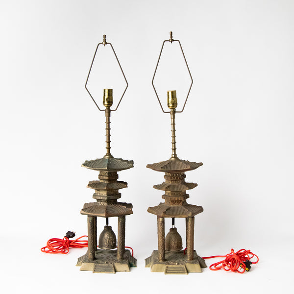 PAIR CAST METAL PAGODA LAMPS WITH BELL BASE AND DYED JUTE LAMP SHADES